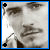 A pixelated close-up of a person's face with two black and blue cross-shaped markers on the corners, showing slight facial expression changes between frames.