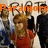 Group of people in red and dark clothing with orange text overlay reading 'Paramore RIOT!' on a light background.