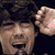 Four distinct pixelated portraits of a young man with dark hair in various poses and backgrounds.