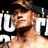 A pixelated image of a person with short brown hair and a beard, wearing a dark cap, positioned in front of large white text on a black background.