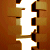 repeating brown and gold letter Ls with dark brown accents on a white background, arranged in a patterned layout