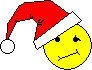 Five yellow smiley faces wearing red Santa hats with white trim and pom-poms, arranged in two against a gray background