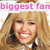 Pixelated image of a smiling person with long blonde hair, wearing a white top with dark accents, under pink text reading 'biggest fan'.