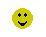 Two yellow pixelated smiley faces on gray background; left face has solid black eyes and mouth, right face has horizontal eye slits with red tongue sticking out.