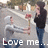 A static image shows three figures in a casual outdoor setting with text at the bottom reading 'Love me...' in white pixelated font.