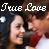 Pixelated image with 'True Love' text above two blurred figures in close proximity.