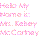 Pixelated pink text on white background reads 'Hello My Name is: Ms. Baboy McCotney' in a blocky, low-resolution style.