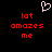 Pixelated red text 'lot amazes me' repeated twice on black background with white heart symbol above center.