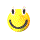 Yellow pixelated smiley face with black eyes and mouth, white eyelashes, on gray background.