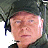 A 48x48 pixel buddy icon featuring a person wearing headphones and a dark cap on the left side, with green text "Original Icons .com" on a dark green background on the right side.