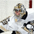 Pixelated image of a hockey goalie in white gear holding a puck, with yellow text on black background reading Best Goalie in the NHL.