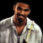Static pixelated image of a person in a white jacket against black background with visible dithering and color blending artifacts.