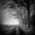 Grayscale pixelated image with a bright central light source surrounded by dark, indistinct shapes and a vertical dark line on the right.