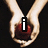 Two hands hold a red apple; the left hand displays a white lowercase 'i' while the right hand shows a white '3' with a black arrow pointing left, with 'edward cullen' text below.