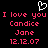 Pixelated red text on black background with white heart symbol above, repeating 'I love you Candice Jane 12.12.07' in two