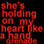 A pixelated buddy icon featuring red text on a black background and a hand holding a bloodied heart graphic.