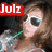 A person with brown hair and white sunglasses holds a green straw in their mouth, with the text "Julz" displayed in different colored backgrounds across six