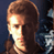 Pixelated static image of a person's face with brown hair and light skin tone against dark background, showing partial profile view with visible eye and mouth area.
