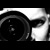 Black-and-white pixelated icon showing a circular object with concentric rings and a curved shape on the right side.