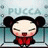 Pixelated character with black hair in twin buns, closed eyes, red cheeks, and red clothing against a light blue background with faint text.
