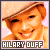 12 identical pixelated images showing a smiling person with light brown hair wearing a beige cap and pearl necklace against a pink background
