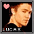 identical pixelated images showing a person with short brown hair, wearing a black shirt, with a pink heart symbol and the text 'LUCAS' below