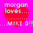 A static image with a bright pink background featuring four identical red hearts, each containing white text reading "morgan loves..." above "...MIKE D!!".