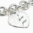 Silver heart-shaped pendant with 'I <3 U' text attached to a chain, displayed in four views showing different angles and cropping.