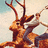 Pixelated image of a deer-like creature with large antlers, brown and orange fur, standing against a light background.