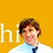 Pixelated image of a person with brown hair wearing light blue shirt and dark tie against solid yellow background, partially obscured by white text.