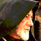 16 shows a person in a dark hooded garment with a white beard, transitioning from a side profile to a front-facing pose with hands raised near the face