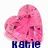 Pixelated pink heart-shaped cotton candy with dark pink spots and scattered light blue dots, below which is blue text reading 'Katie' in blocky letters.