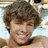 A pixelated image of a person with light brown hair lying on a white surface, accompanied by text elements in separate