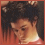A pixelated image split into two sections: a person with dark curly hair on the left and orange text reading 'PROUD AAA MEMBER' on the right.
