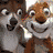 Animated icon featuring two cartoon animals with text elements in multiple colors and styles.