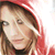 A static image featuring a person with light brown hair wearing a red hooded garment, alongside text reading "ASHLEE SIMPSON" and "BITTERSWEET WORLD" in stylized fonts.