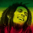 Pixelated portrait of a person with long dark hair, yellow-green skin tone, and red clothing against green-yellow background.