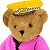 A pixelated teddy bear wearing a yellow cap and pink jacket with green text on the right side of the image.