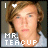 Pixelated image of a person with light brown hair wearing a white shirt, featuring text "MR. TEACUP" and changing heart symbols above the head.