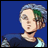 Pixelated anime-style character with short gray hair and green streaks, wearing dark blue shirt with light blue and yellow accents, against solid blue background.