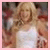 A blonde woman in a white dress appears in two side-by-side frames with different backgrounds and poses.