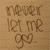 Pixelated brown text on a beige background forms three lines of stylized characters with decorative loops and curves.