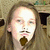 A person with long light brown hair and a mustache appears in three showing slight variations of facial expression