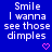 Blue background with white pixelated text reading "Smile I wanna see those dimples" and a pink heart symbol at bottom right.