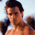 Pixelated image of a shirtless man with dark hair against light background, next to green text reading 'Original Icons .com' in bright green pixel font.