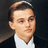 A pixelated image of a person in a dark suit and white shirt with text "never let go" on a black background.