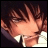 Pixelated anime-style character with brown hair and closed eyes, wearing a white shirt and dark jacket, next to stylized text on black background.