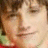 Pixelated portrait of a person with brown hair and light skin, next to red pixelated text reading ANNA HUTCHERSON <33 on white background.