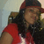 A person wearing a red cap and red shirt with white accents appears in a of four , with the rightmost blank