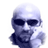 Pixelated static icon of a bald figure with dark sunglasses and a raised hand gesture against white background.